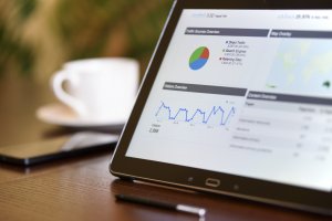 Tablet standing on a desk with Google Search Console open, showing SEO metrics